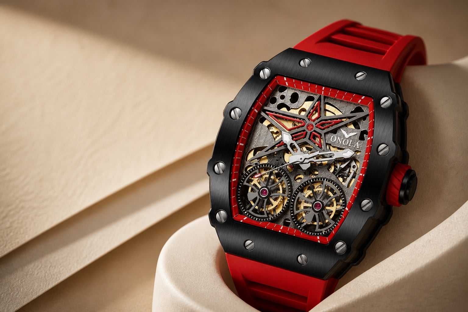 Red ONOLA skeleton watch with a black tonneau case and red strap on a warm sculptural background